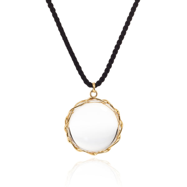 Rock crystal "looking glass" pendant in 18k yellow gold vine on black silk cord.