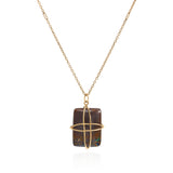 Boulder opal cushion cut pendant in an 18k yellow setting on a reclaimed antique finish chain.