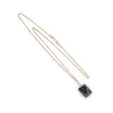 Boulder opal cushion cut pendant in an 18k yellow setting on a reclaimed antique finish chain.